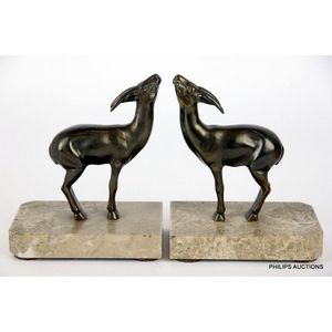 A pair of spelter gazelle bookends, circa 1930s, an opposite…