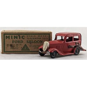 Minic/Tri-Ang, England: a tin plate wind up Ford saloon,…