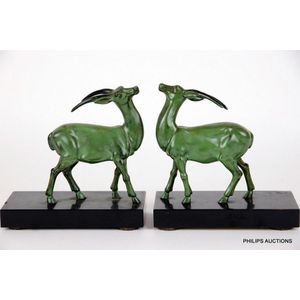 A pair of Art Deco cold painted spelter gazelle book ends,…