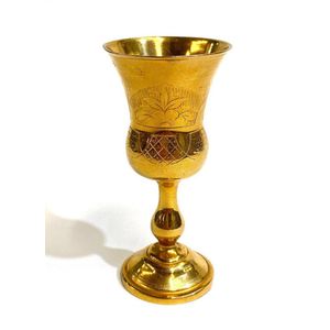 A gold plate kiddush wine cup, engraved detail with unverified…