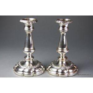 A pair of Sheffield plate candlesticks, circa 1830, with their…
