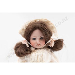 SFBJ bisque doll blue sleeping eyes, dark brown hair wig on…
