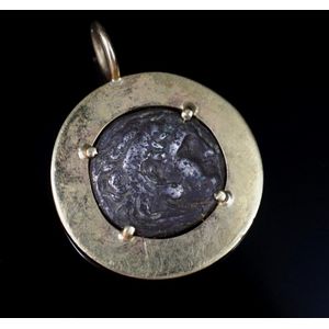 Antique or vintage pendant with coin 