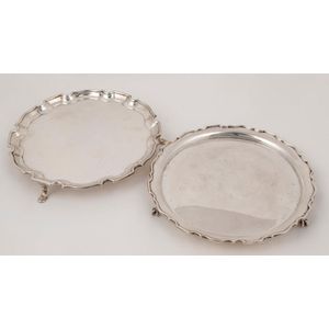 Two English sterling silver salvers, by Adie Brothers Ltd., and…