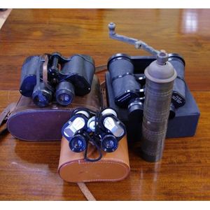 Three vintage pairs of binoculars, with cases, together with a…