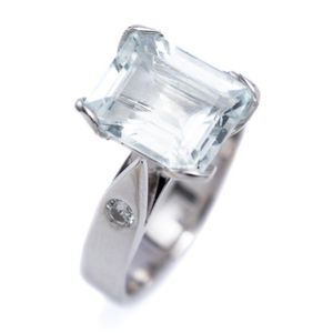 An 18ct white gold aquamarine and diamond ring; set with an…