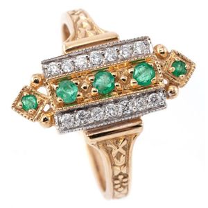 An Edwardian style emerald and diamond ring; perpendicular…