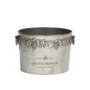 A large oval double Champagne cooler with embossed grape…