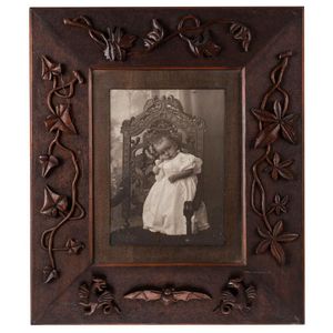 An Australian folk art carved cedar picture frame with a period…