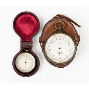 Two pocket cased brass barometers, both in moulded leather…