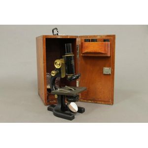 A late 19th century American microscope in fitted wooden case…