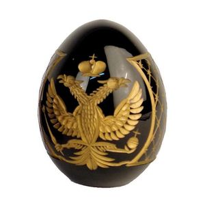 A vintage dark cobalt glass egg, engraved and gilded with the…