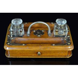 A Victorian oak twin bottle Inkstand, c.1880, decorated with…