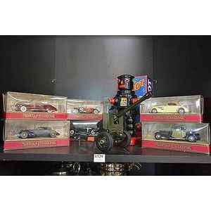 A group of toys including matchbox models of yesteryear, wind…