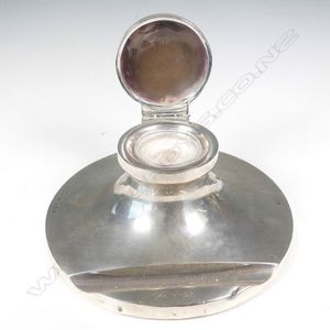 A silver inkstand, capstan shape with depression for pen,…