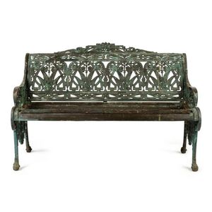 A garden bench, solid cast bronze and timber, English,…