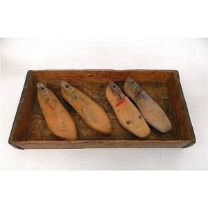 A Redfern shoe factory tray, containing original shoe lasts