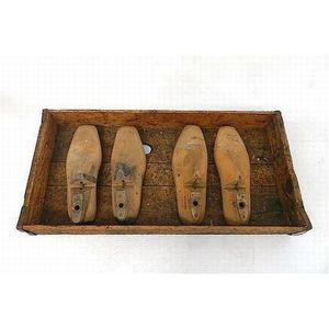 A Redfern shoe factory tray, containing original shoe lasts