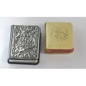 Hallmarked silver covered miniature bible with another…