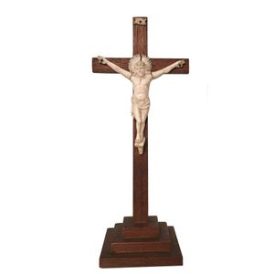 A carved ivory Corpus Christi on oak stand, early 20th century,…