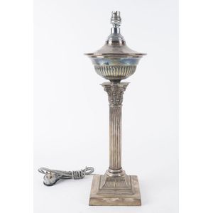 An antique silver plated oil lamp, converted for electricity,…