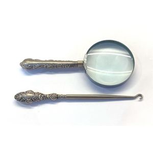 A sterling silver handle boot hook, Chester, 1912 and a…