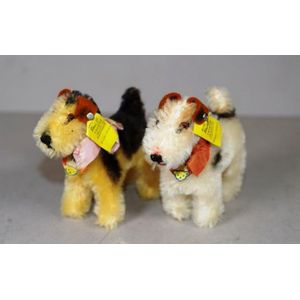 Two vintage miniature Steiff dog figures, with buttons & tags