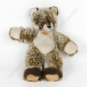 A vintage Steiff raccoon, 1972, with button and paper label.