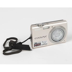 Nippon Kogaku: Nikon Coolpix S230 digital camera, c. 2009, with…