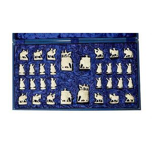 A Persian carved ivory chess set, early 20th century, carved as…