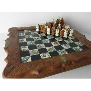 Chess pieces: 32 red and white ivory pieces without board., Complete number  of pieces of a chess game. Sixteen cut ivory pieces that have been made red  with a dyestuff: these are