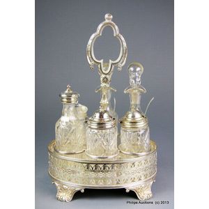 A silver plate and glass cruet set, late 19th to early 20th…