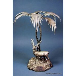 An Elkington silver plate table centrepiece, 1878, featuring a…