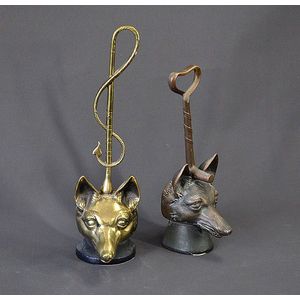 Near pair early brass fox head door stops. Handles with whip…