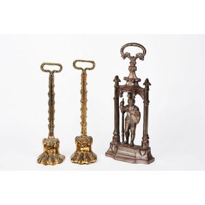 Three brass and cast metal door stops, 19th century, two cast…