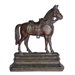 A Victorian brass door stop, in the form of a horse on a…