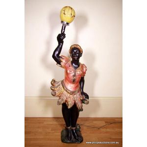 A Chalkware female blackamoor floor lantern, circa 1930-1940s,…
