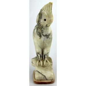 Alabaster carved figure of a cockatoo set upon a base, with…