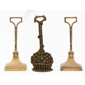 A collection of brass doorstops, 20th century and later,…