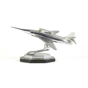 An Art Deco table lighter in the form of a rocket propelled…