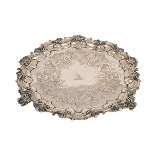 An antique English sterling silver salver with rococo revival…