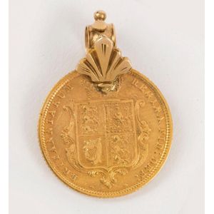 An 1883 half sovereign (22ct), with antique 15ct gold loop…