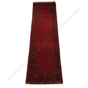 A hand knotted Bokhara runner, the field decorated with…