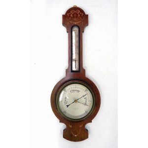 An English Edwardian A. E Coe Norwich barometer, with satinwood…