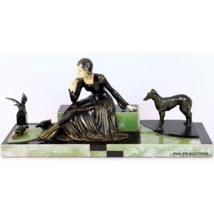 An Art Deco spelter and ivorine figural group signed Menneville,…