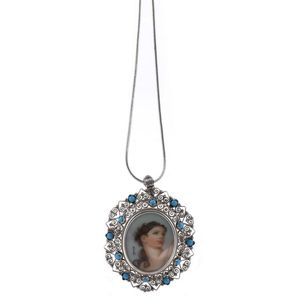 A hand-painted miniature portrait pendant in Continental silver…