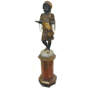 A rare 19th century gesso on wood standing blackamoor female…