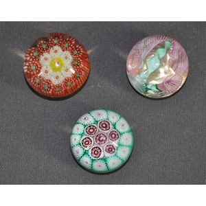 Three various small glass paperweights. Two millefiori and One…