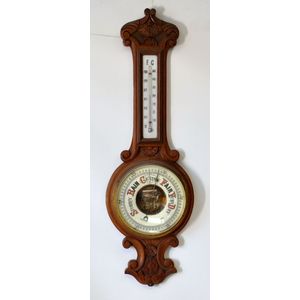 C 1910 oak cased aneroid barometer. Large barometer and…