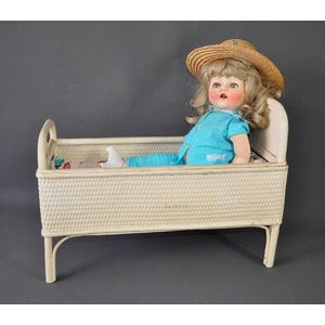 Lloyd Loom dolls bed and doll. White painted woven cane bed…